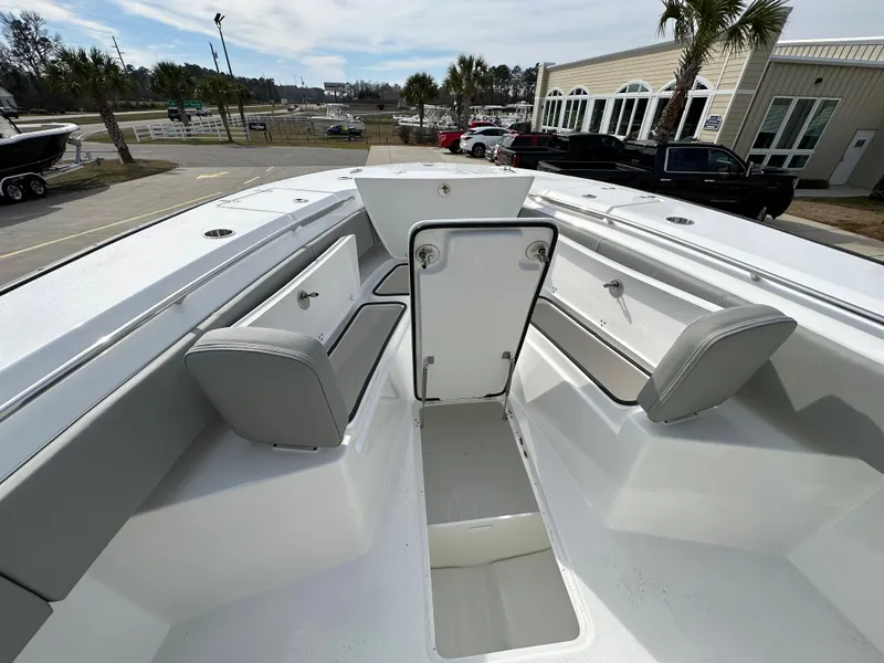 Slide: The Image of 2024 Cape Horn 32 XS boat interior with seating and storage compartments. - 23