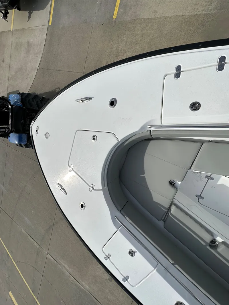 Slide: The Image of 2024 Cape Horn 32 XS boat bow view, docked on concrete. - 29