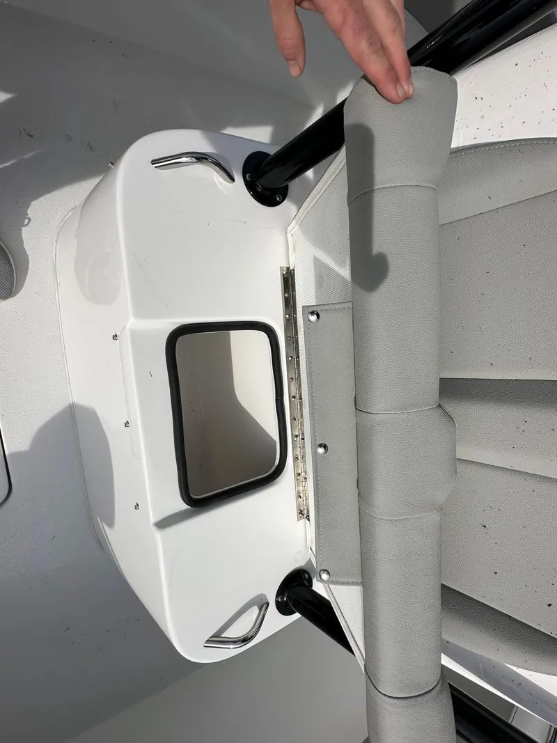 Slide: The Image of 2024 Cape Horn 32 XS boat interior detail with storage compartment. - 22