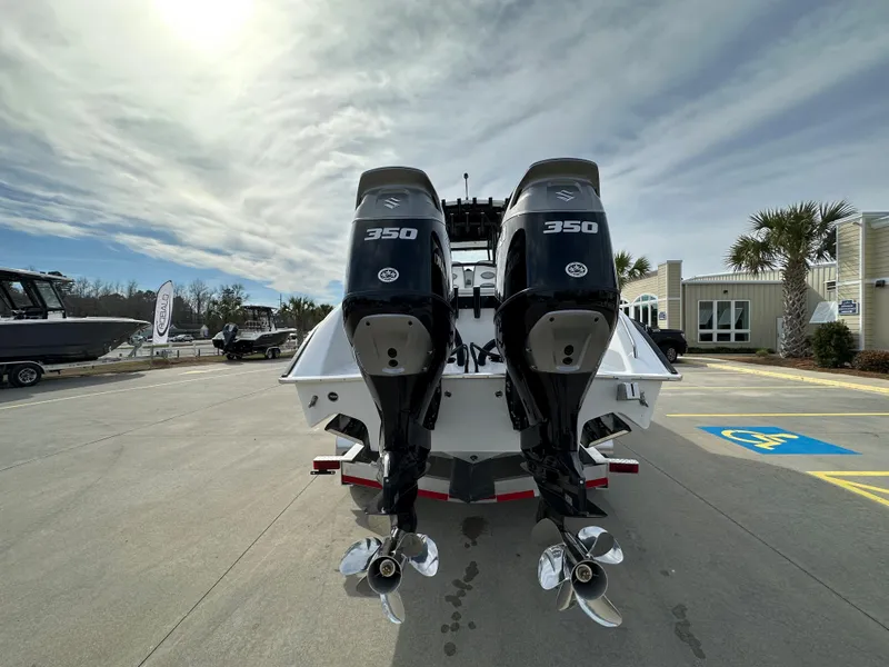 Slide: The Image of 2024 Cape Horn 32 XS boat with twin 350 HP engines, rear view. - 3