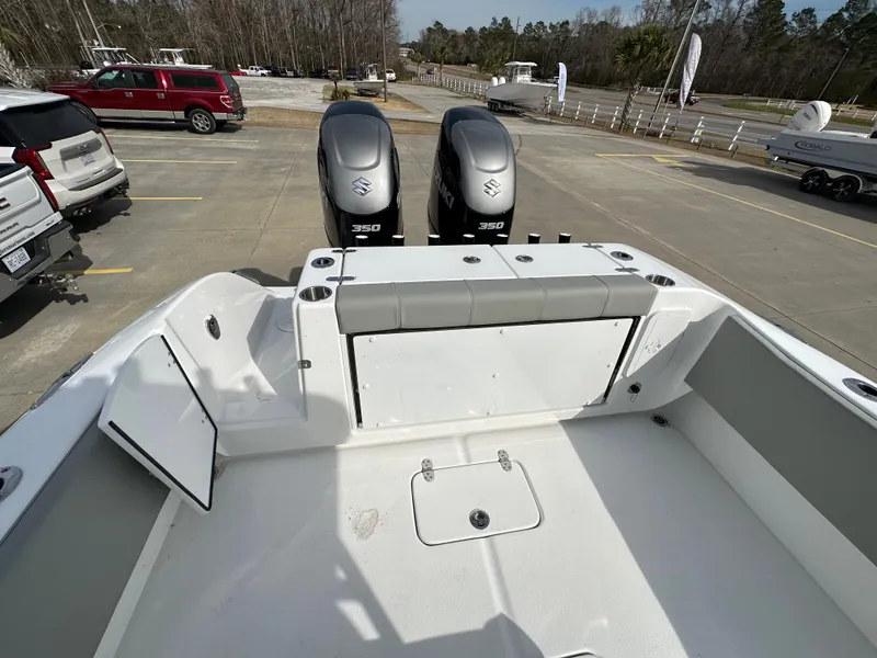 Slide: The Image of 2024 Cape Horn 32 XS boat with dual Suzuki 350 engines, rear seating, and spacious deck. - 9