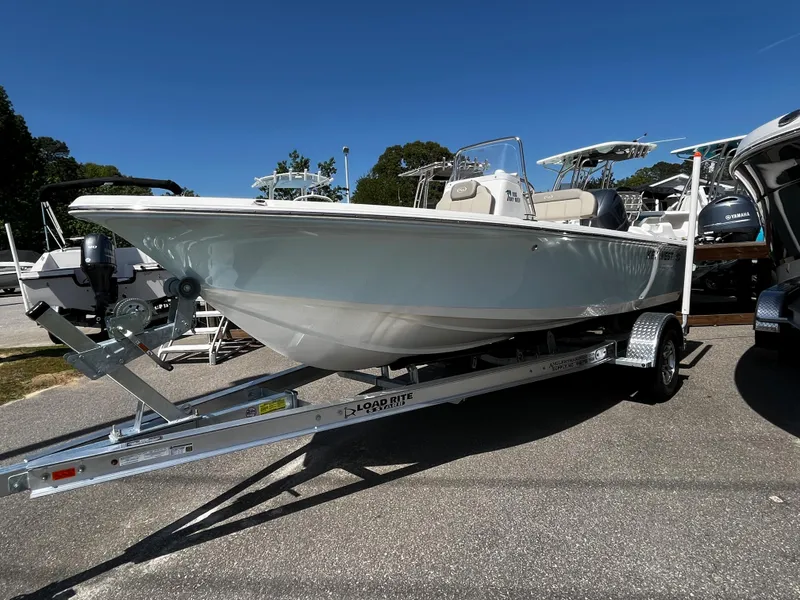 The Image of 2024 Key West 188 Bay Reef boat on a trailer in a marina. - 0