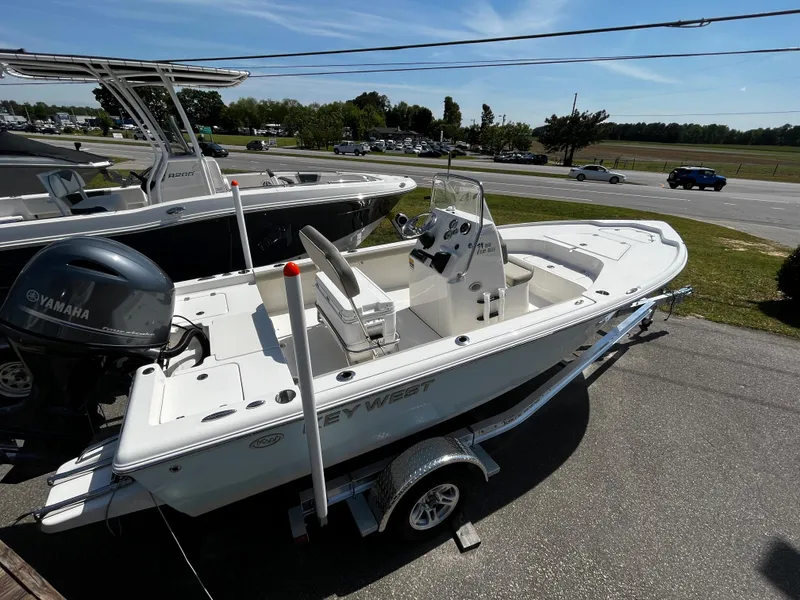 Slide: The Image of 2024 Key West 188 Bay Reef boat on trailer with Yamaha outboard motor. - 1