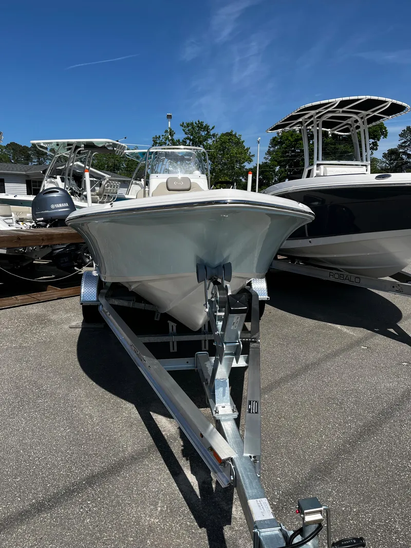 Slide: The Image of 2024 Key West 188 Bay Reef boat on a trailer under a clear blue sky. - 2
