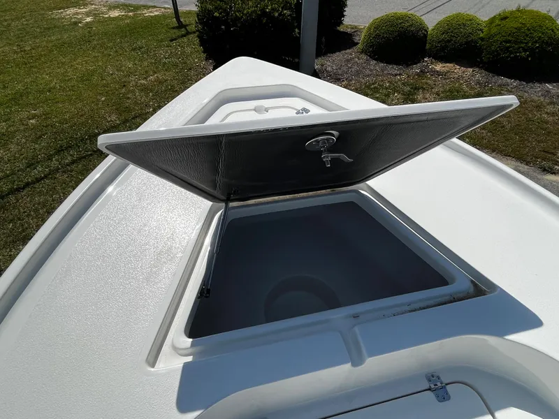 Slide: The Image of 2024 Key West 188 Bay Reef boat with open storage compartment. - 5