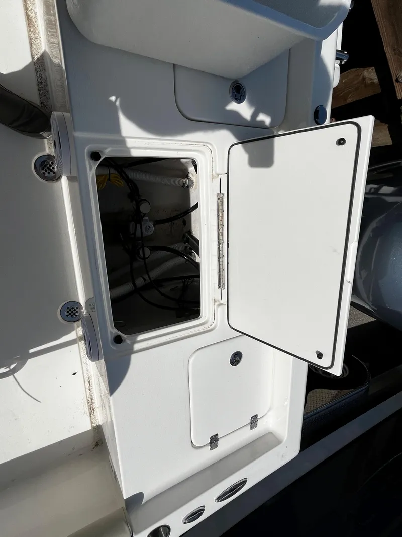 Slide: The Image of 2024 Key West 188 Bay Reef boat storage compartment open. - 6