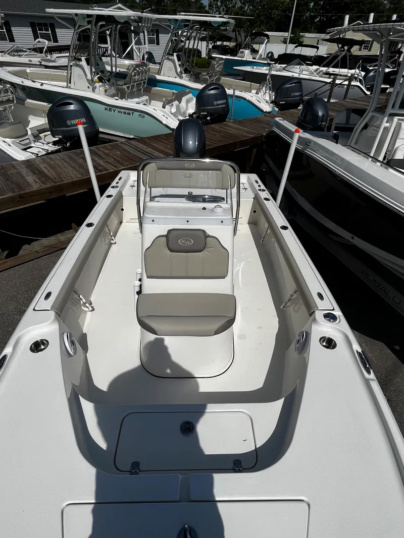 Slide: The Image of 2024 Key West 188 Bay Reef boat interior with seating and console. - 8