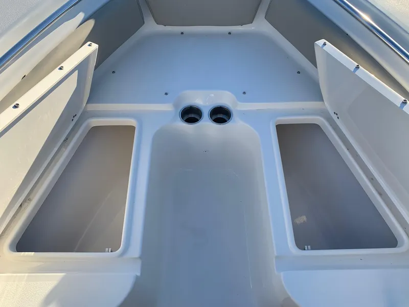 Slide: The Image of 2024 Key West 219 FS boat storage compartments and seating area. - 19