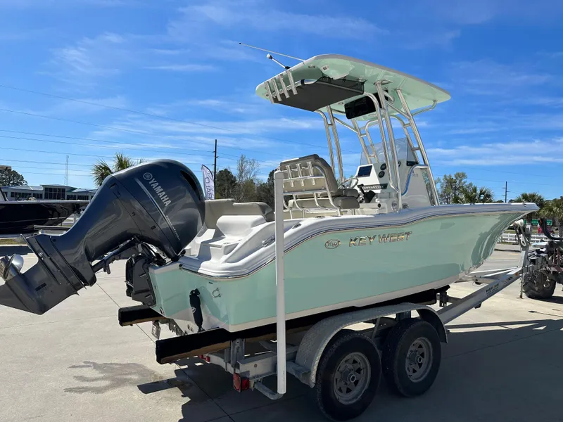 Slide: The Image of 2024 Key West 219 FS boat on a trailer with Yamaha outboard motor. - 4