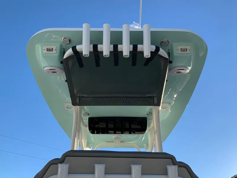 Slide: The Image of 2024 Key West 219 FS boat T-top with rod holders and storage. - 6