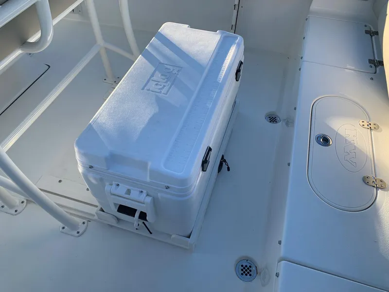 Slide: The Image of 2024 Key West 219 FS boat interior with a white cooler. - 9