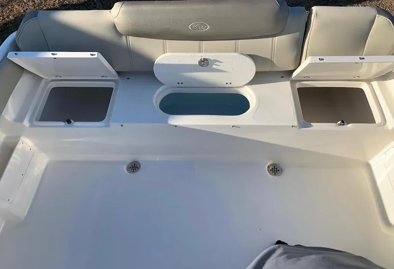 Slide: The Image of 2024 Key West 239 FS boat interior with storage compartments and seating. - 11