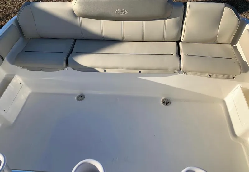 Slide: The Image of 2024 Key West 239 FS boat with spacious seating and cup holders. - 12