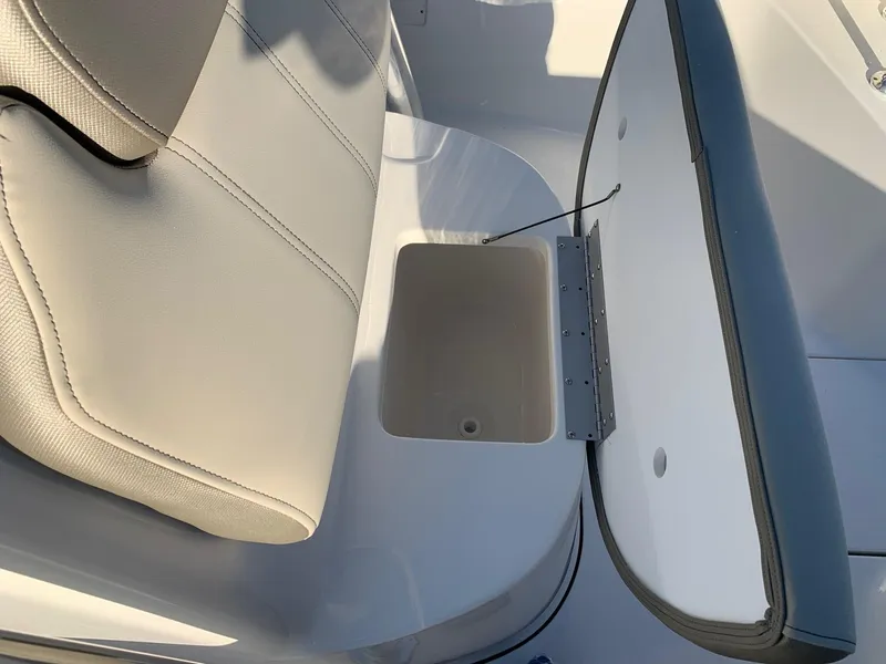 Slide: The Image of 2024 Key West 239 FS boat seat with storage compartment. - 14
