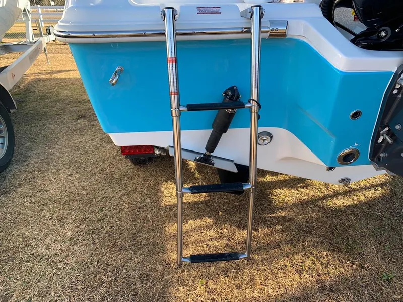 Slide: The Image of 2024 Key West 239 FS boat with a stainless steel swim ladder. - 17