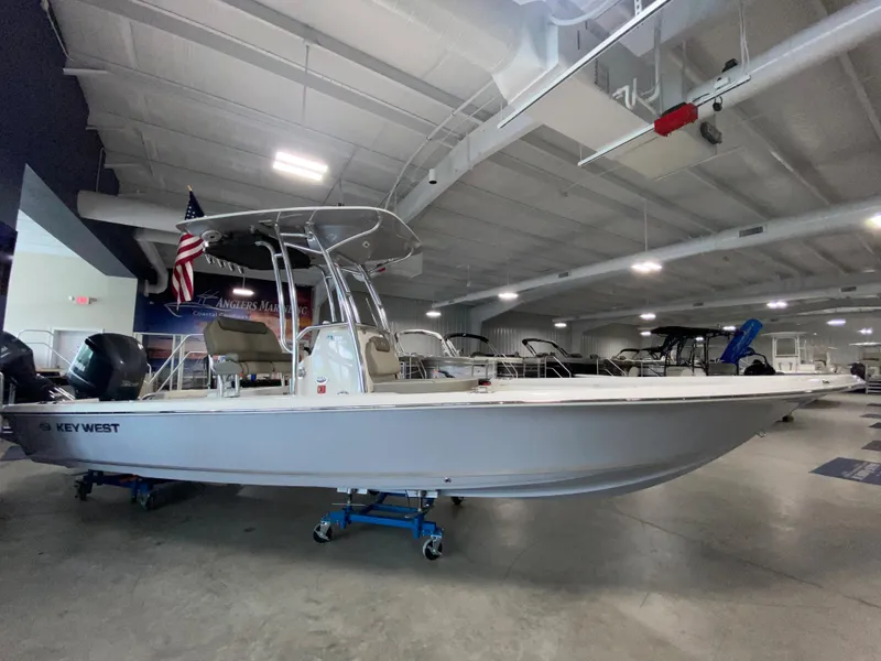 The Image of 2024 Key West 250 Bay Reef boat displayed in a showroom. - 0