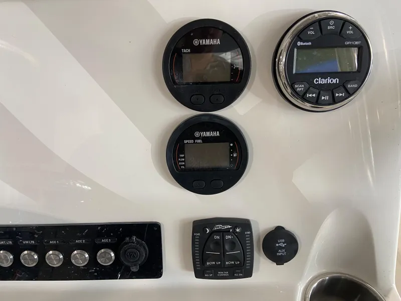 Slide: The Image of Control panel of a 2024 Key West 250 Bay Reef boat with Yamaha and Clarion gauges. - 10