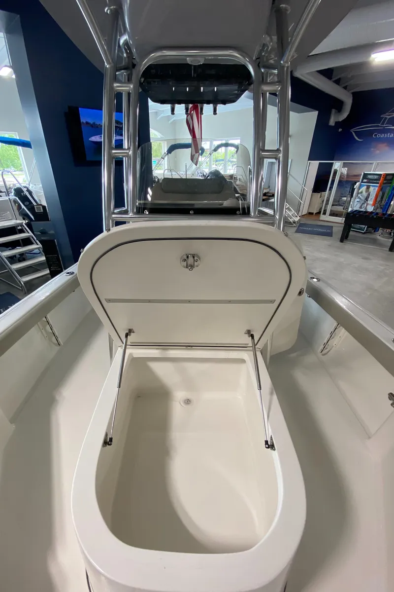 Slide: The Image of 2024 Key West 250 Bay Reef boat with open storage compartment. - 22