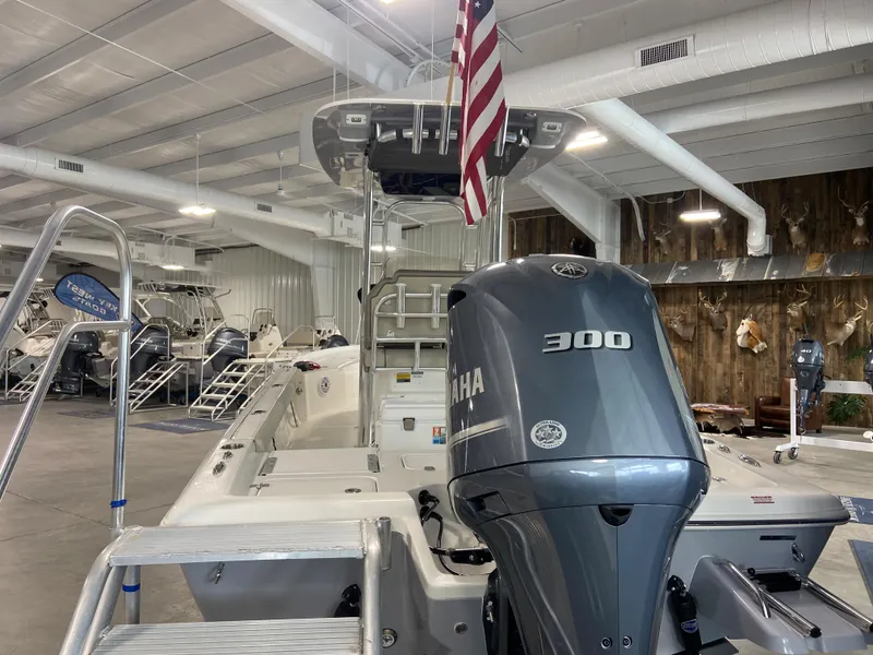 Slide: The Image of 2024 Key West 250 Bay Reef boat with Yamaha 300 engine in showroom. - 5