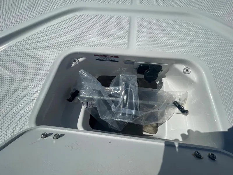 Slide: The Image of 2024 Robalo 226 Cayman boat storage compartment with equipment. - 20