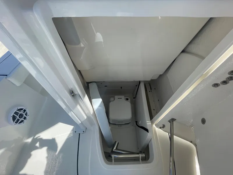 Slide: The Image of 2024 Robalo 226 Cayman boat interior with compact marine toilet - 21
