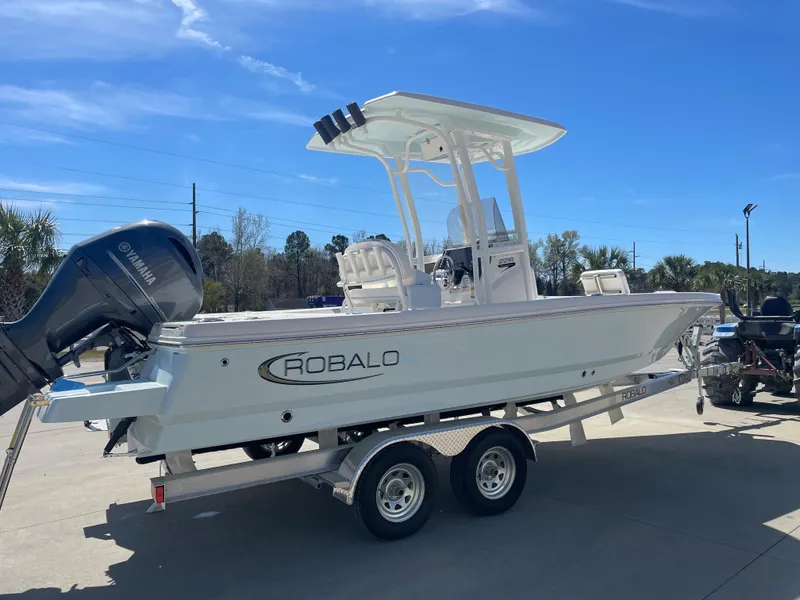 Slide: The Image of 2024 Robalo 226 Cayman boat on a trailer with Yamaha outboard motor. - 4