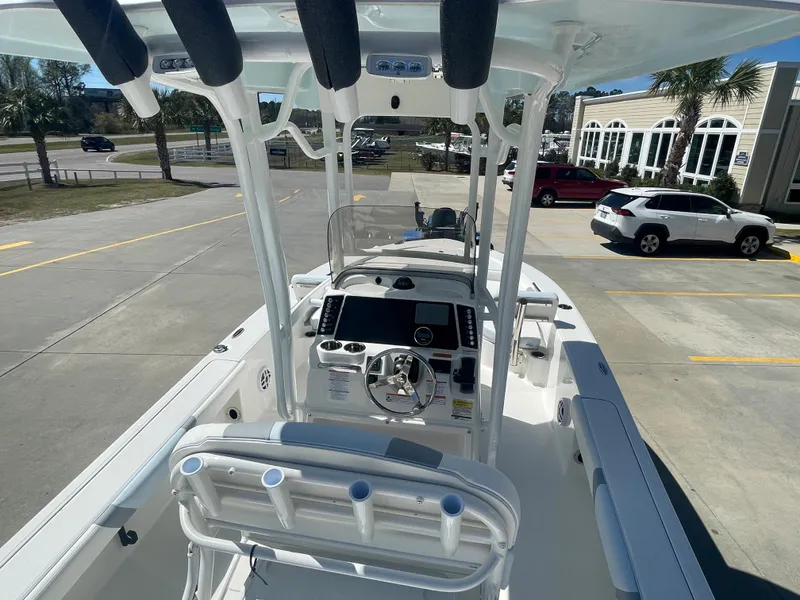 Slide: The Image of 2024 Robalo 226 Cayman boat interior with console and seating. - 8