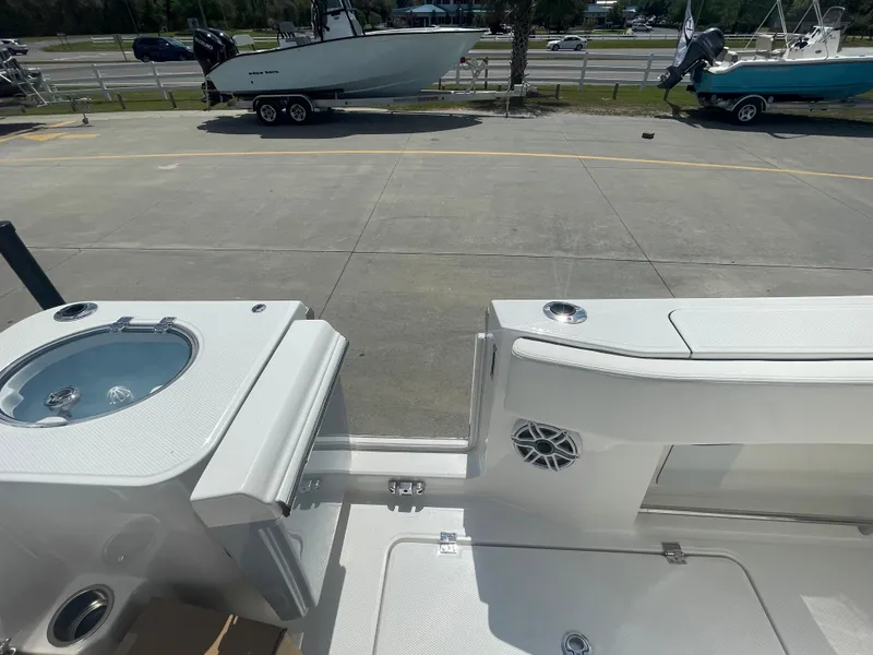 Slide: The Image of 2023 Robalo 270 boat interior with livewell and seating area. - 31