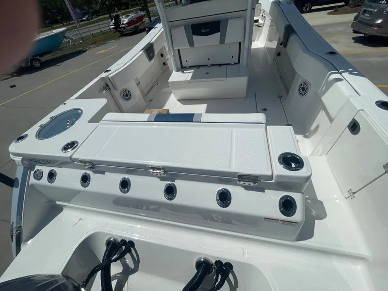 Slide: The Image of 2023 Robalo 270 boat interior with seating and storage compartments. - 8