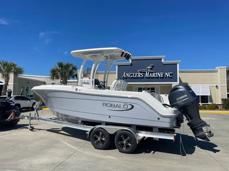 Slide: The Image of 2024 Robalo R222 Center Console boat on trailer at Anglers Marine NC. - 1