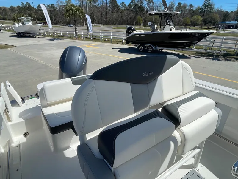Slide: The Image of 2024 Robalo R222 Center Console boat interior with cushioned seating. - 6