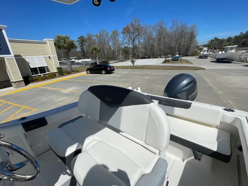 Slide: The Image of 2024 Robalo R222 Center Console boat in a parking lot. - 8