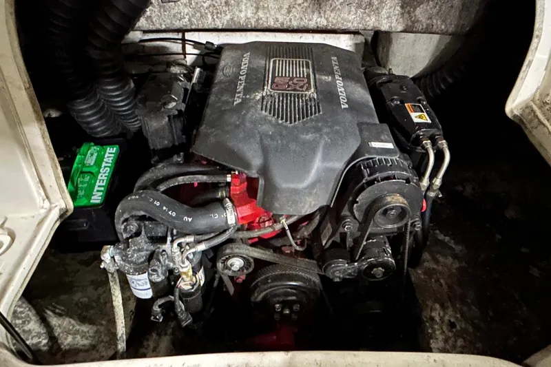 Slide: The Image of 2002 Larson Escape 213 boat engine compartment with Volvo Penta motor and Interstate battery. - 20