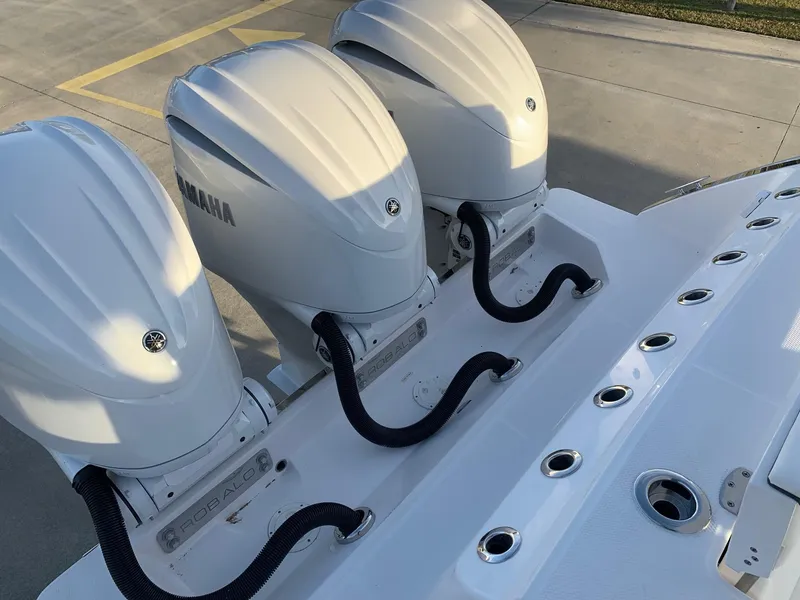 Slide: The Image of 2024 Robalo R360 boat with triple Yamaha outboard engines. - 11
