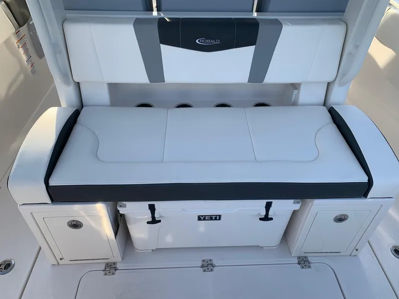 Slide: The Image of 2024 Robalo R360 boat seating with Yeti cooler storage. - 17