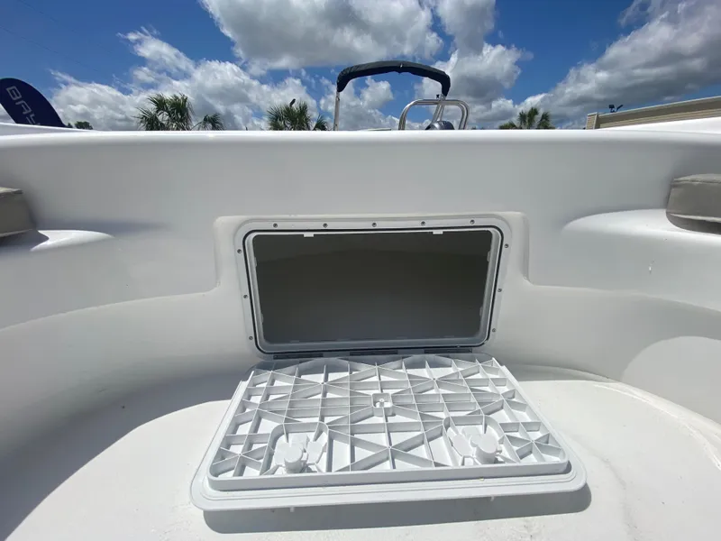 Slide: The Image of 2024 Savannah SS21 boat storage compartment open under blue sky. - 17