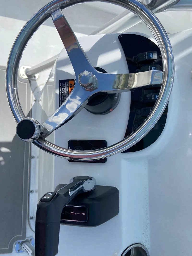 Slide: The Image of 2024 Savannah SS21 boat steering wheel and throttle controls - 19