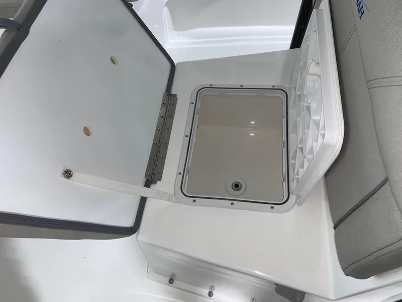 Slide: The Image of Open storage compartment in 2024 Savannah SS21 boat. - 11
