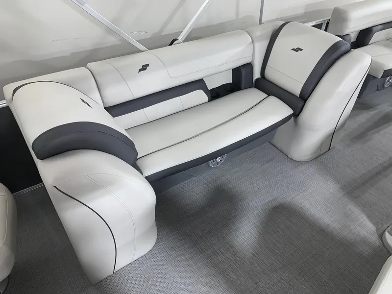 Slide: The Image of 2024 Starcraft EX22 FD boat interior seating with gray and white upholstery. - 9