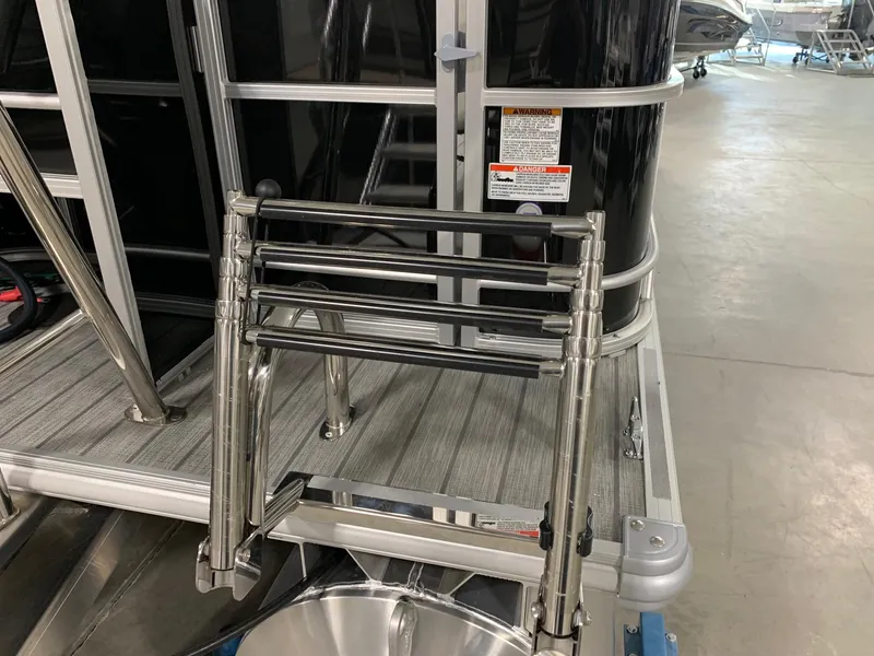 Slide: The Image of 2024 Starcraft EX22 FD pontoon boat with stainless steel boarding ladder. - 3