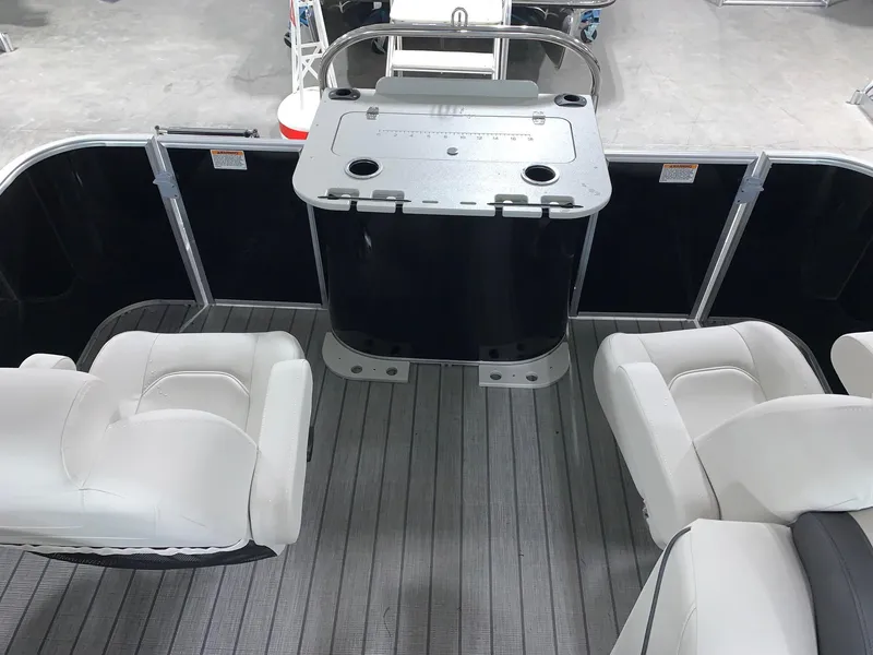 Slide: The Image of 2024 Starcraft EX22 FD boat interior with seating and table. - 6