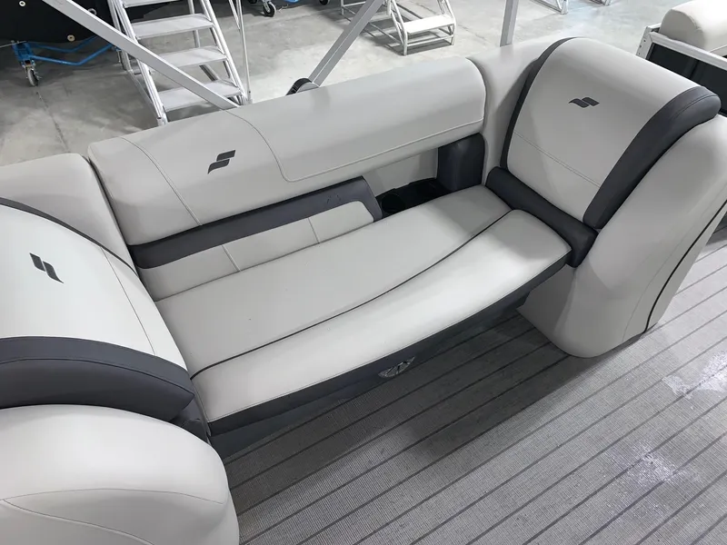 Slide: The Image of 2024 Starcraft EX22 FD boat interior seating with gray and white upholstery. - 7