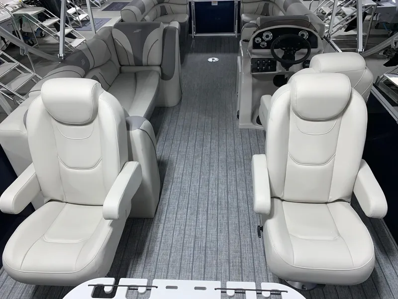 Slide: The Image of 2024 Starcraft EX22 FD boat interior with luxurious seating and modern dashboard. - 20