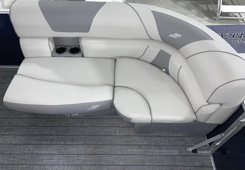 Slide: The Image of 2024 Starcraft EX22 FD boat interior with gray and white cushioned seating. - 5