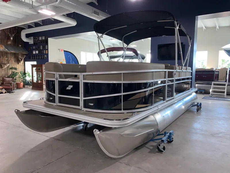 Slide: The Image of 2024 Starcraft LX20 R pontoon boat in showroom. - 1