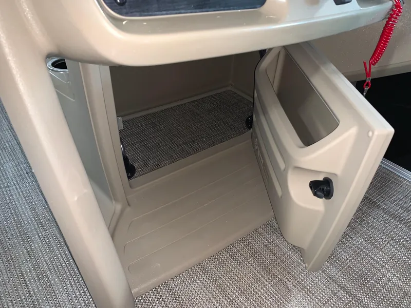 Slide: The Image of 2024 Starcraft LX20 R boat storage compartment with open door. - 8