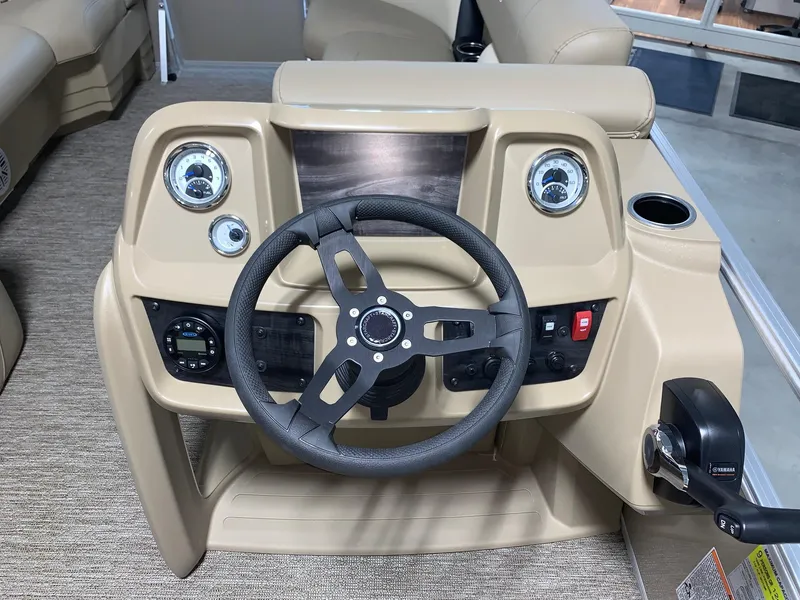 Slide: The Image of 2024 Starcraft LX22 R boat dashboard with steering wheel and control panel. - 10