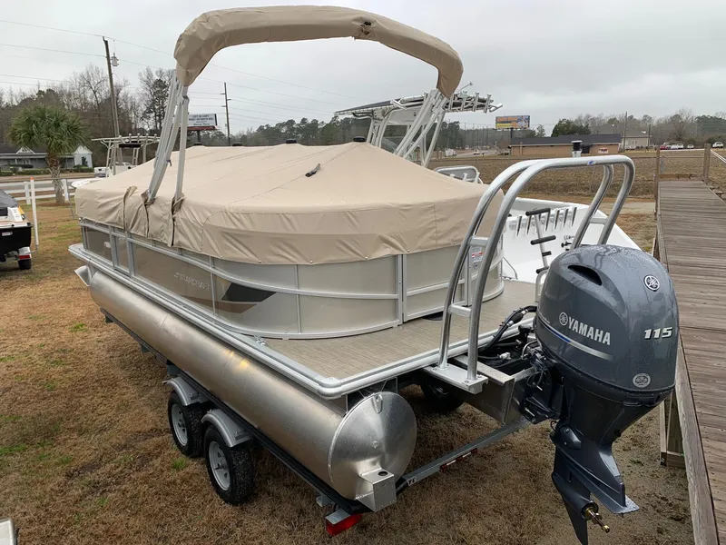 Slide: The Image of 2024 Starcraft LX22 R pontoon boat with Yamaha 115 outboard motor. - 3