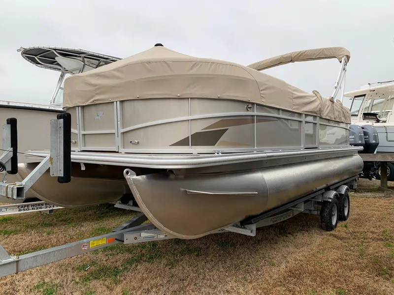Slide: The Image of 2024 Starcraft LX22 R pontoon boat on trailer, covered and ready for transport. - 4
