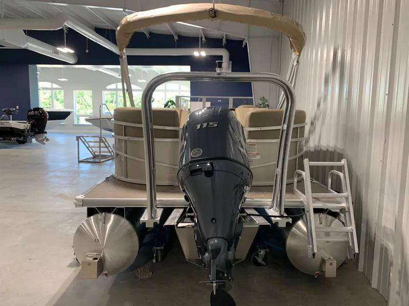 Slide: The Image of 2024 Starcraft LX22 R pontoon boat with 115 HP engine in showroom. - 5